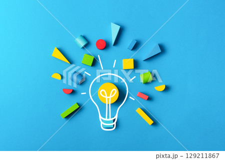 Idea creativity education concept with lightbulb colorful geometric shapes on blue. Symbol of inspiration, innovation, learning, brainstorming Idea creativity education concept with lightbulb colorful geometric shapes on blue. Symbol of inspiration, innovation, learning, brainstorming 129211867