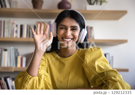 Beautiful Indian businesswoman or teacher start video call using application Beautiful Indian businesswoman or teacher start video call using application 129212335