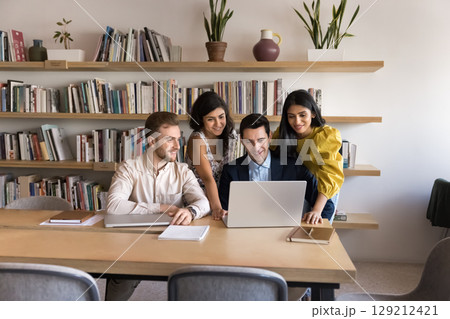 Four workmates talking, brainstorm using modern laptop 129212421