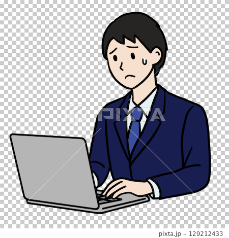 A man with a troubled expression working on a computer 129212433