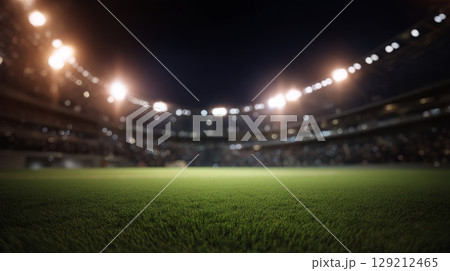 Vast stadium under bright stadium lights, focusing on vibrant field grass. Evening atmosphere with blurred background seating. Captures tranquility of unoccupied arena. Neural network AI generated 129212465
