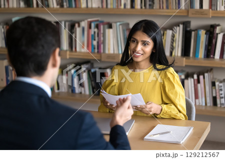 HR manager listening male vacancy applicant during job interview 129212567