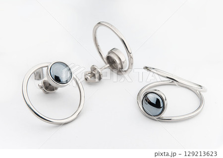Silver jewels collection with crystals in minimalism style. Silver set of earrings and silver necklace Silver jewels collection with crystals in minimalism style. Silver set of earrings and silver necklace 129213623