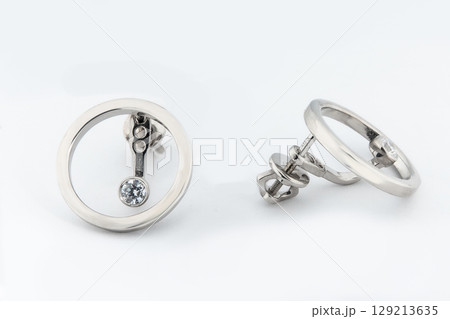 Luxury silver round earrings big jewelry for women isolated on white background, clipping path included Luxury silver round earrings big jewelry for women isolated on white background, clipping path included 129213635