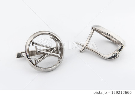 Luxury silver round earrings big jewelry for women isolated on white background, clipping path included Luxury silver round earrings big jewelry for women isolated on white background, clipping path included 129213660