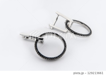 Luxury silver round earrings big jewelry for women isolated on white background, clipping path included Luxury silver round earrings big jewelry for women isolated on white background, clipping path included 129213661