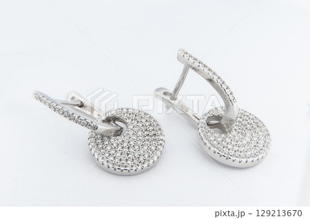 Luxury silver round earrings big jewelry for women isolated on white background, clipping path included 129213670