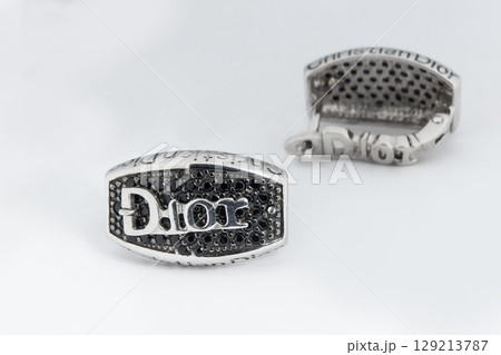 Luxury silver round earrings big jewelry for women isolated on white background, clipping path included Luxury silver round earrings big jewelry for women isolated on white background, clipping path included 129213787