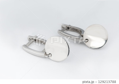 Luxury silver round earrings big jewelry for women isolated on white background, clipping path included Luxury silver round earrings big jewelry for women isolated on white background, clipping path included 129213788