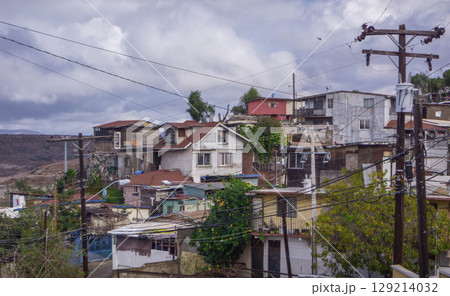 Gritty panorama of Colonia Libertad neighborhood, Tijuana, with weathered homes, reflecting social and economic struggles amid crime and poverty.  129214032