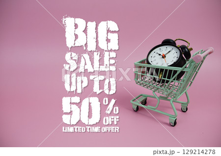 Big Sale 50% off Promotion and Marketing with trolley shopping cart and alarm clock on pink background 129214278