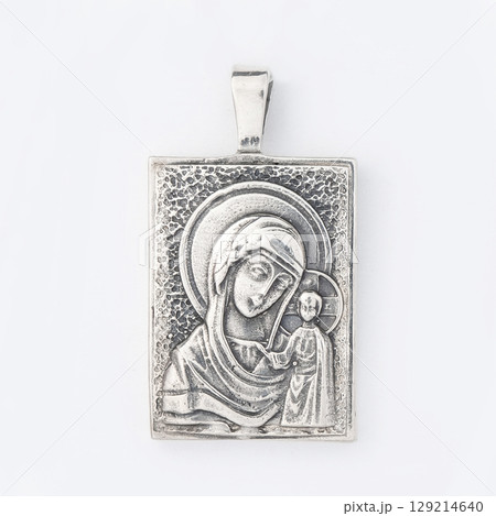 Gold pendant with the Virgin Mary christian symbol isolated on white Gold pendant with the Virgin Mary christian symbol isolated on white 129214640
