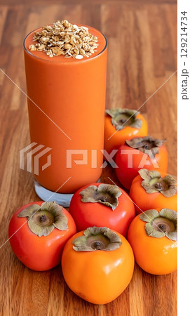 Refreshing Persimmon Smoothie Topped With Crunchy Granola. 129214734