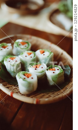 Cute Vegetable Rolls Shaped Like Snowmen in a Basket. 129214829