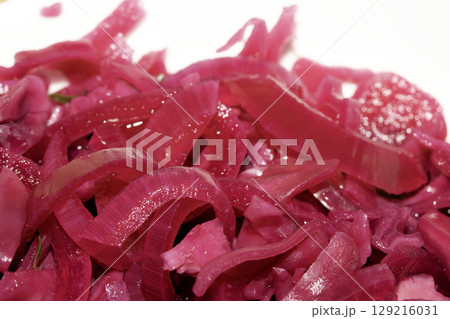 Close up of pickled chopped red cabbage on white background Close up of pickled chopped red cabbage on white background 129216031