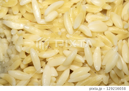 Close up of orzo pasta rice shaped carbs tasty cooked 129216038