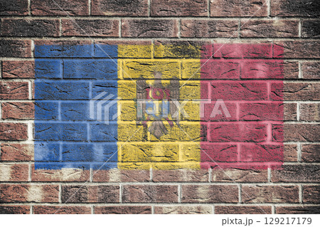 Moldova flag on old brick wall background Moldova flag on old brick wall background 129217179