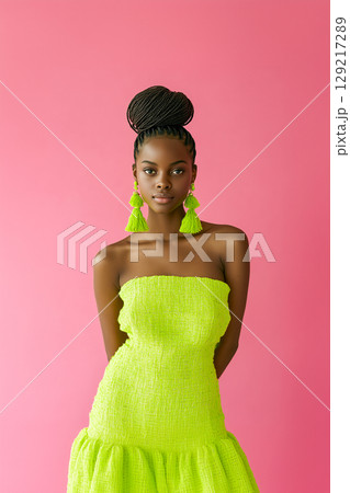 A woman in a green dress with green tassels on her ears 129217289