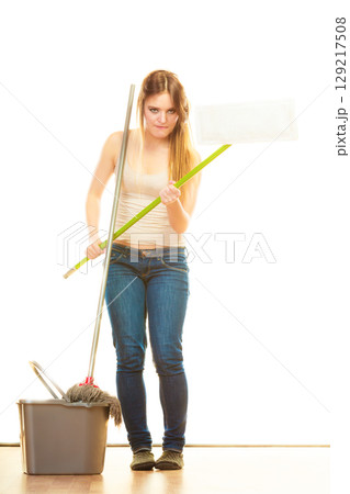 Tired cleaning woman mopping floor Tired cleaning woman mopping floor 129217508