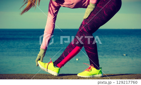 Woman fitness sport girl training outdoor in cold weather 129217760