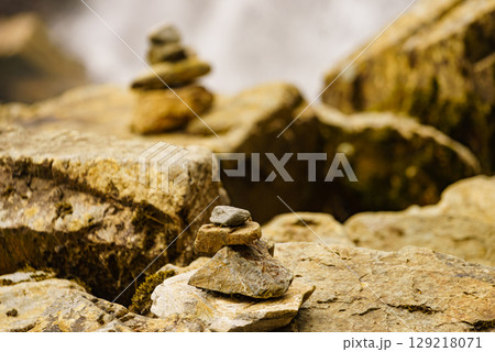 Stone stack and waterfall, Norway Stone stack and waterfall, Norway 129218071