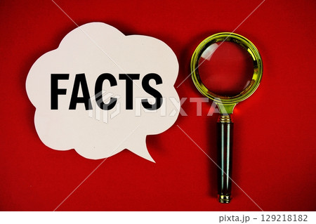 Facts text with speech bubble and magnifying glass on red background 129218182