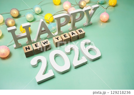 Happy New Year 2026 alphabet letter with LED cotton balls on green background 129218236