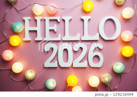 Hello 2026 alphabet letter with cotton ball LED decoration on pink background Hello 2026 alphabet letter with cotton ball LED decoration on pink background 129218494
