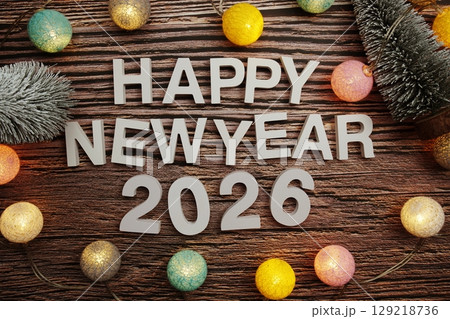 Happy New Year 2026 alphabet letters on wooden background Happy New Year 2026 alphabet letters on wooden background 129218736