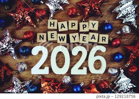Happy New Year 2026 alphabet letters with Christmasl Decoration on wooden background 129218756