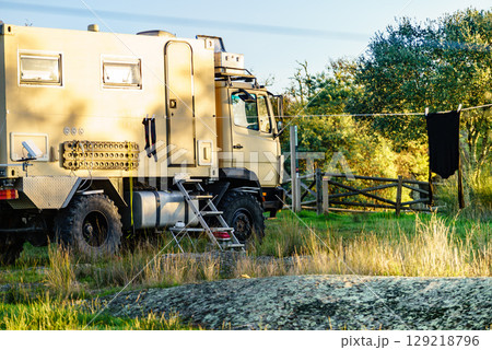 Offroad camper 4x4 truck on nature Offroad camper 4x4 truck on nature 129218796