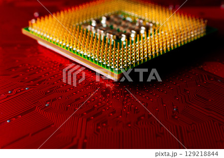 Electronic components. Electronic printed circuit board close-up, accent red color Electronic components. Electronic printed circuit board close-up, accent red color 129218844