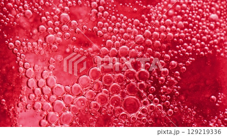 Close-up of red bubbles macro texture. Neural network AI generated 129219336