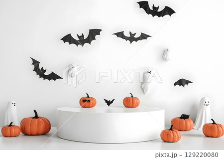Minimal Halloween product display mockup with white podium, pumpkins, and spooky elements. Perfect for showcasing products or promotional graphics. Minimal Halloween product display mockup with white podium, pumpkins, and spooky elements. Perfect for showcasing products or promotional graphics. 129220080