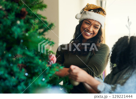 Mother, child and christmas, tree decoration and holiday celebration, happy smile and love together in home. Latino woman, child and happiness on xmas, celebrate and christmas tree in family home Mother, child and christmas, tree decoration and holiday celebration, happy smile and love together in home. Latino woman, child and happiness on xmas, celebrate and christmas tree in family home 129221444