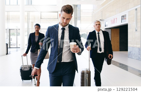 Travel, international meeting and business people walking in hotel, airport and reception area with suitcase. Teamwork, collaboration and group of managers travelling for global business meeting Travel, international meeting and business people walking in hotel, airport and reception area with suitcase. Teamwork, collaboration and group of managers travelling for global business meeting 129221504