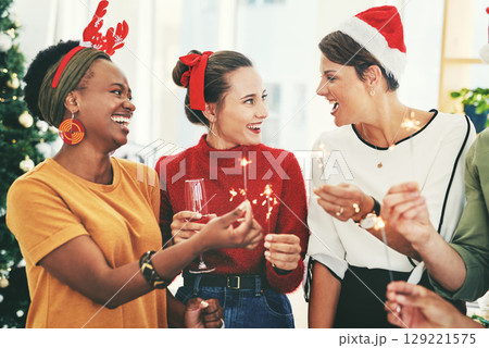 Christmas, party and sparklers with business people in office for celebration, champagne and festive season. Diversity, teamwork and friends with employee and drink glass for holiday, cheers or event 129221575