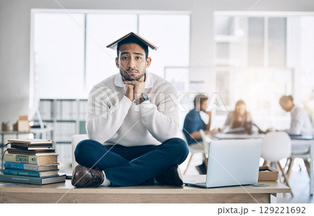 Business man, books and learning with a frustrated, sad and tired entrepreneur on desk for burnout, stress and anxiety. Portrait of a bored law student and employee in office to study, learn and work 129221692