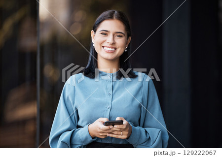 Business woman, portait and smile with phone typing, happy to email or doing online, internet or web search. Career female with mobile smartphone working in social media marketing outdoor in the city Business woman, portait and smile with phone typing, happy to email or doing online, internet or web search. Career female with mobile smartphone working in social media marketing outdoor in the city 129222067