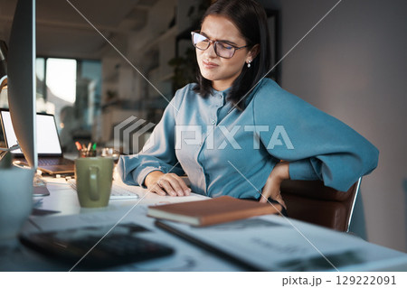 Corporate, computer or business woman with back pain in office while working on laptop, research or planning. Worker, employee or manager suffering with accident at desk with anatomy or spine problem Corporate, computer or business woman with back pain in office while working on laptop, research or planning. Worker, employee or manager suffering with accident at desk with anatomy or spine problem 129222091