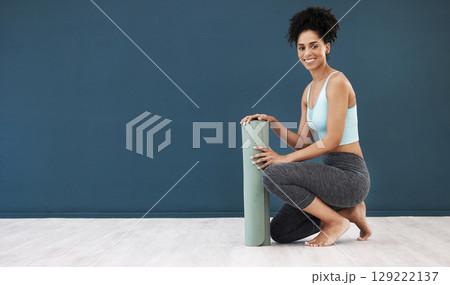 Yoga, portrait and black woman, mockup and fitness, healthy lifestyle or wellness marketing, advertising space and sports branding. Happy female workout, blank wall and exercise mat in pilates studio 129222137