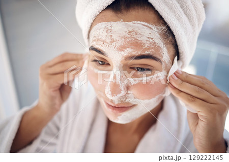 Woman, face mask and cotton pad, facial treatment and detox dermatology after shower in home bathroom. Young female, skincare cleaning product and cosmetics for shine, glow and beauty transformation Woman, face mask and cotton pad, facial treatment and detox dermatology after shower in home bathroom. Young female, skincare cleaning product and cosmetics for shine, glow and beauty transformation 129222145