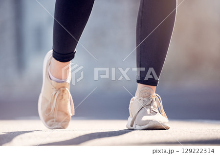 Athlete woman, running and shoes on street for fitness, workout and training outdoor in summer sunshine. Runner girl, sneakers and exercise on city road, ground or metro for health, wellness or sport Athlete woman, running and shoes on street for fitness, workout and training outdoor in summer sunshine. Runner girl, sneakers and exercise on city road, ground or metro for health, wellness or sport 129222314