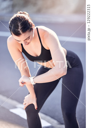 Woman runner, sports watch and running time for outdoor marathon training, cardiovascular exercise and cardio workout on road. Heart rate, race time and smartwatch for tracking vitals or performance 129222315