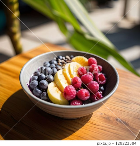 Vibrant Acai Bowl in Open-Air Cafe 129222384
