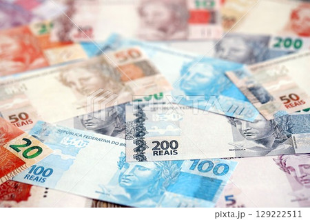 Brazilian reais banknotes. The current Brazil real money bills lies on table in big amount 129222511
