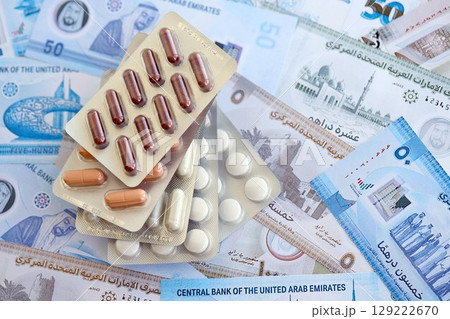 United Arab Emirates dirham currency money bills and medicine pills. The concept of medicine and pharmacy 129222670