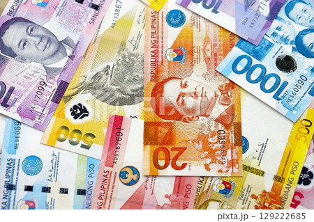 Philippines peso currency money bills. The current banknotes lies on table in big amount 129222685