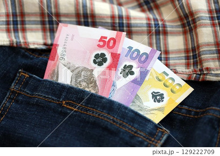 Philippines peso money bills in denims pocket. The concept of fashion and wealth 129222709