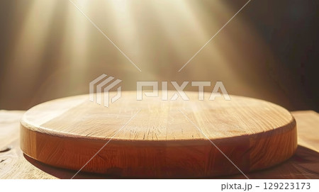 Sophisticated wooden podium with subtle backlight and haze in gentle golden brown hues 129223173